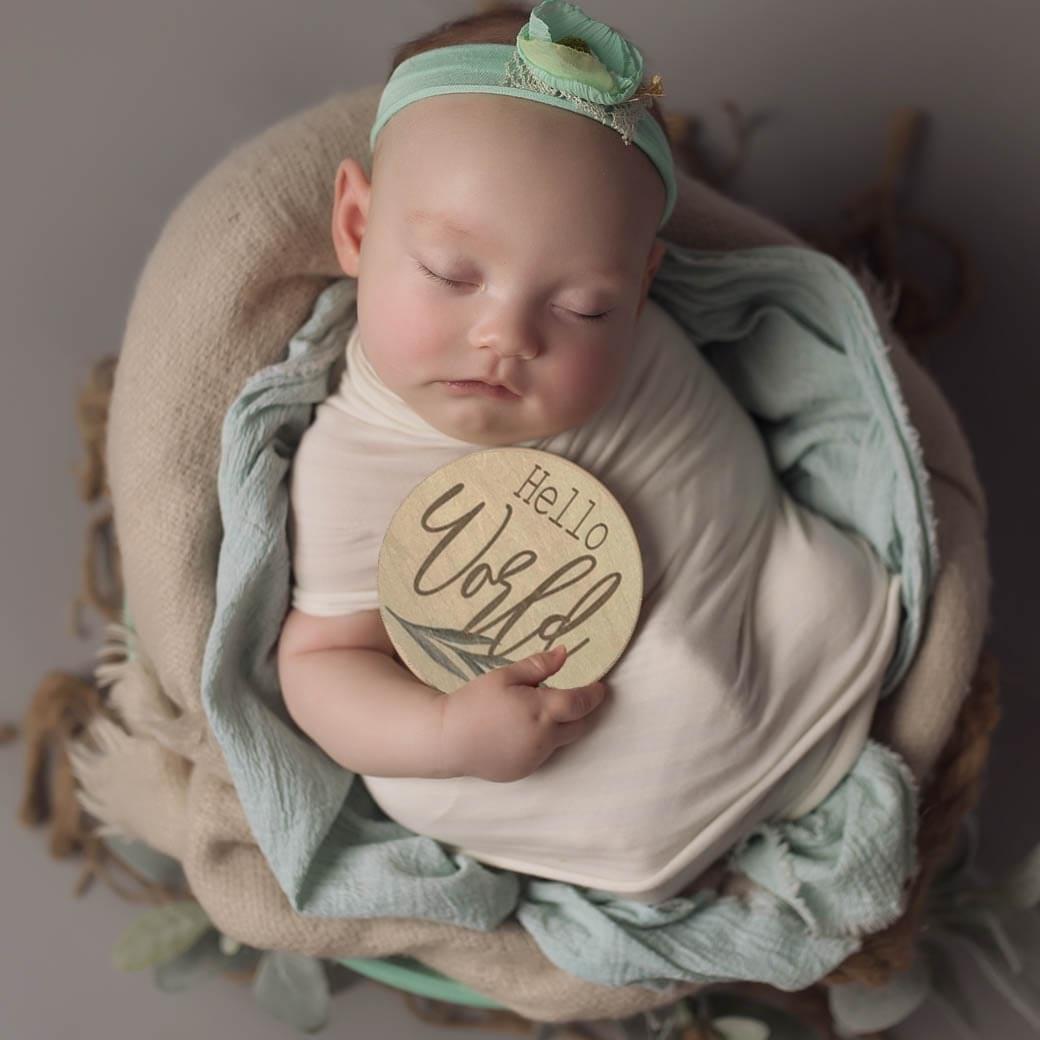 Baby with hello world card