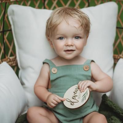 Eleven month baby with botanical milestone cards